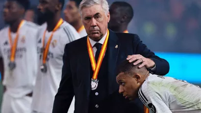 A comforting hug. Carlo Ancelotti hugs Kylian Mbappe, his team's best player, during their huge win against Barcelona.